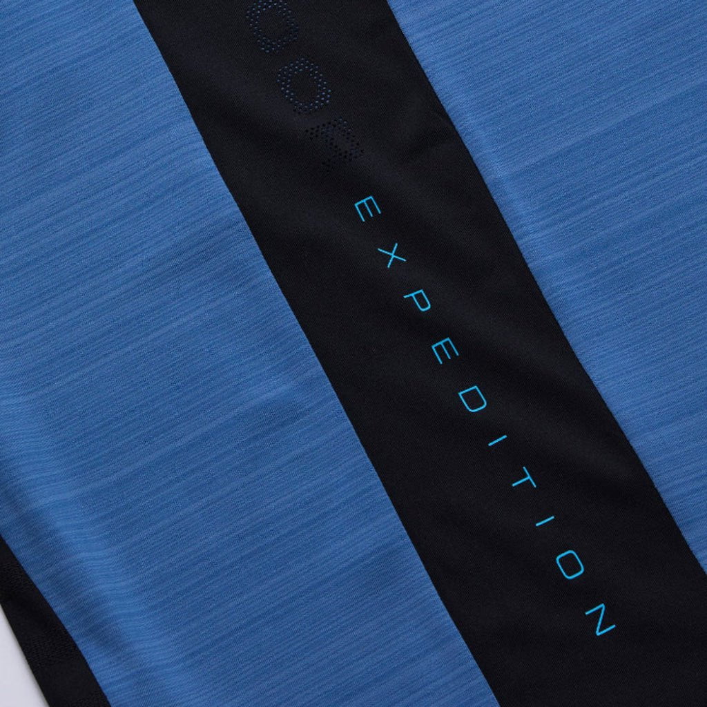 Close-up of a blue and black fabric with 'Expedition' branding.