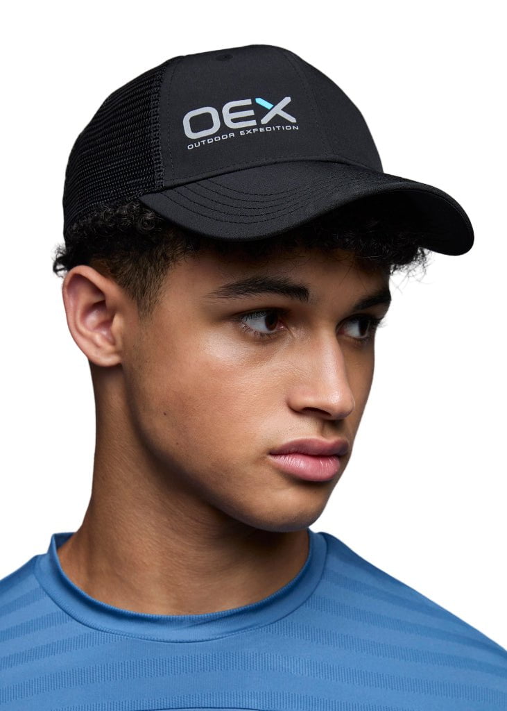 Person wearing a black cap with 'OEX' logo on a white background