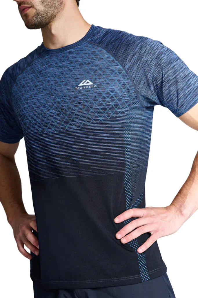 Person wearing a blue and black athletic shirt with a brand logo on a light gray background