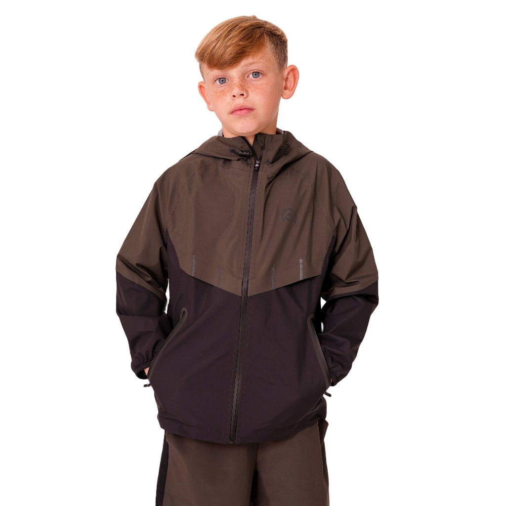 Child wearing a two-tone jacket with a brown and black design on a white background